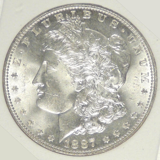 1887 Mogan Dollar, MS-63+ in SGS holder