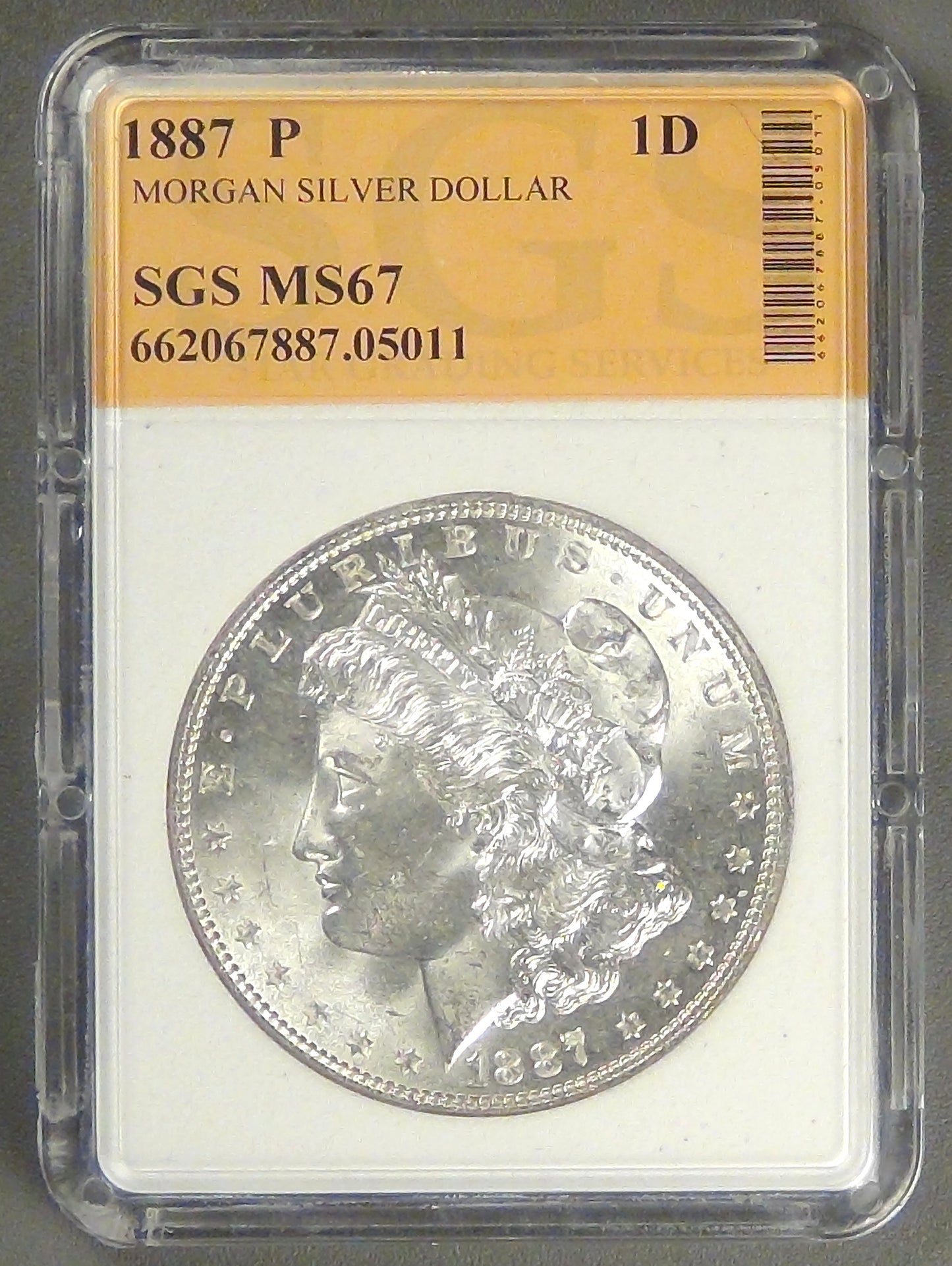 1887 Mogan Dollar, MS-63+ in SGS holder